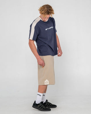 Man wearing Strikewear Baggy Twill Short in Abbey Stone