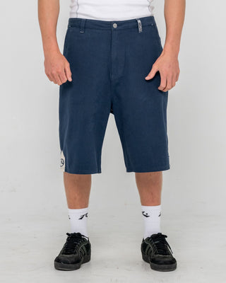 Man wearing Strikewear Baggy Twill Short in Dark Blue