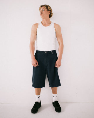Man wearing Strikewear Baggy Twill Short in Dark Blue