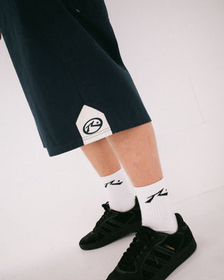 Man wearing Strikewear Baggy Twill Short in Dark Blue