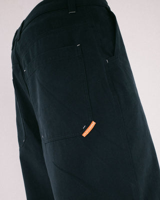 Man wearing Strikewear Baggy Twill Short in Dark Blue