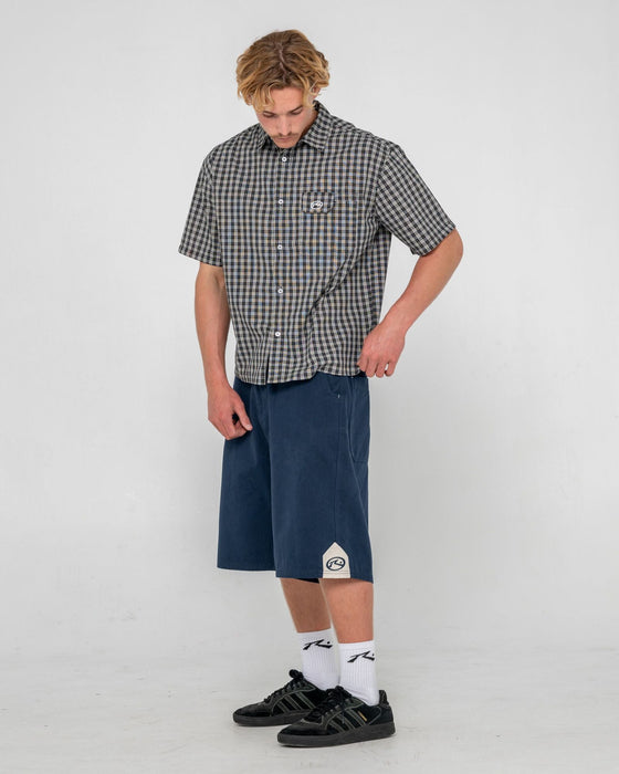 man-wearing-strikewear-baggy-twill-short-in-dark-blue
