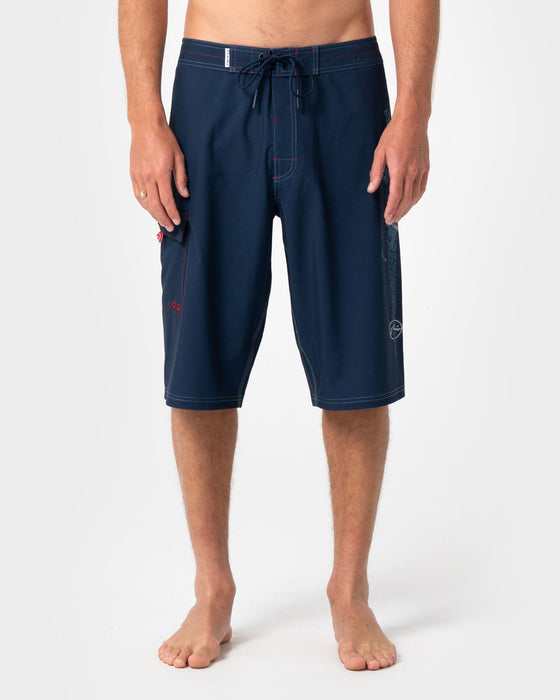 man-wearing-morning-glory-fixed-waist-boardshort-in-navy-blue