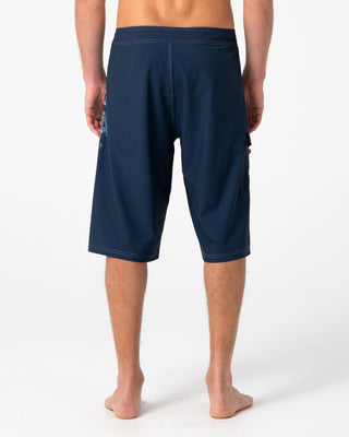 Man wearing Morning Glory Fixed Waist Boardshort in Navy Blue