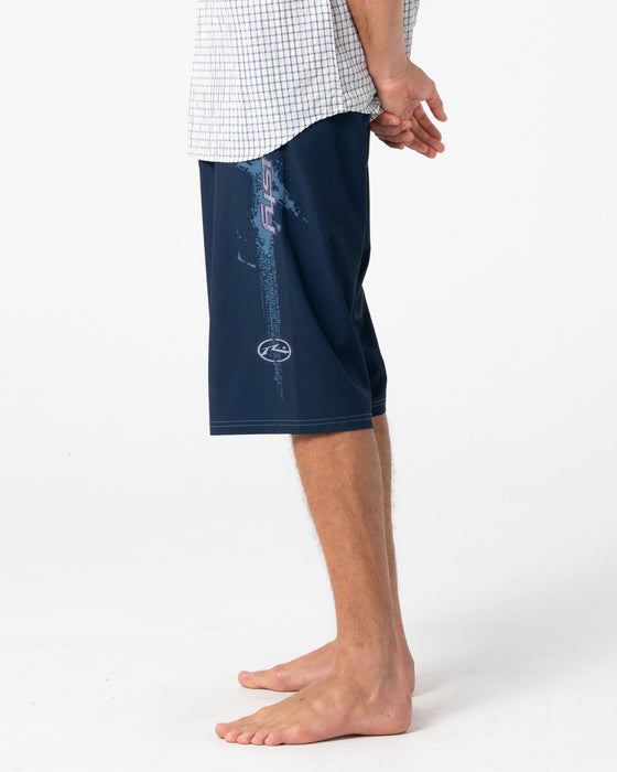 man-wearing-morning-glory-fixed-waist-boardshort-in-navy-blue