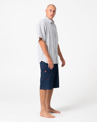 Man wearing Morning Glory Fixed Waist Boardshort in Navy Blue