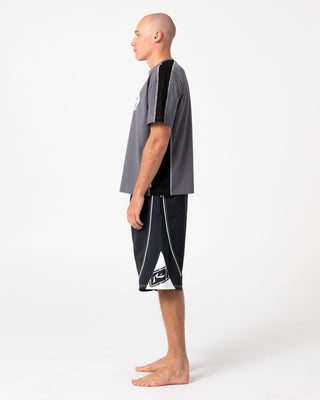 Man wearing Deathroll Hybrid Waist Boardshort in Black