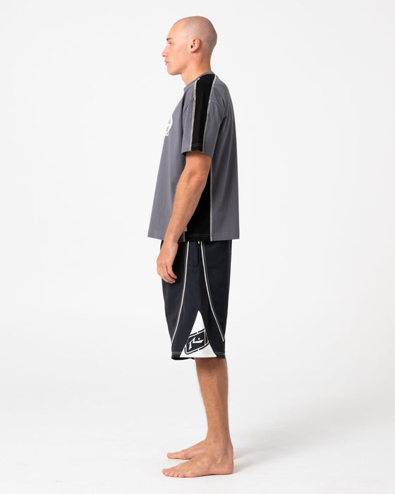 man-wearing-deathroll-hybrid-waist-boardshort-in-black