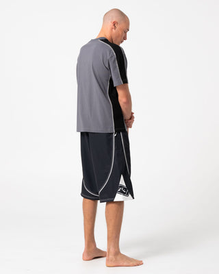 Man wearing Deathroll Hybrid Waist Boardshort in Black