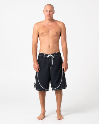 Man wearing Deathroll Hybrid Waist Boardshort in Black