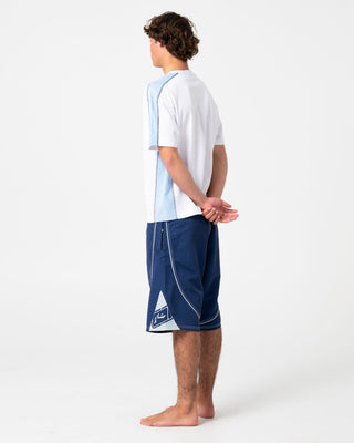 Man wearing Deathroll Hybrid Waist Boardshort in Dark Blue