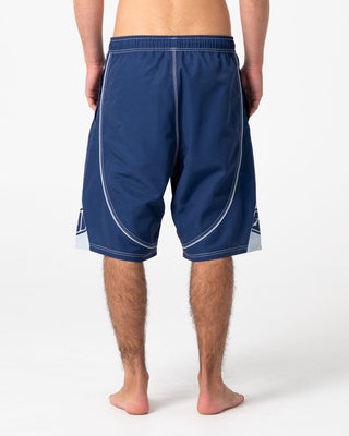 Man wearing Deathroll Hybrid Waist Boardshort in Dark Blue