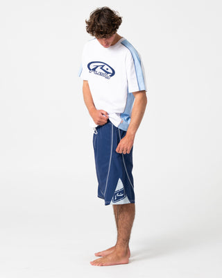Man wearing Deathroll Hybrid Waist Boardshort in Dark Blue