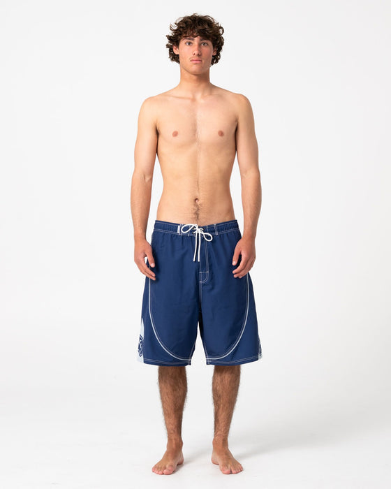 man-wearing-deathroll-hybrid-waist-boardshort-in-dark-blue