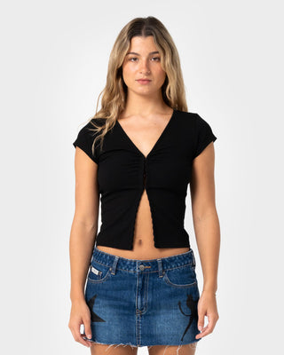 Woman wearing Im Hooked Cap Sleeve Fashion Top in Black