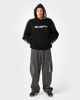 Man wearing Lay Low Hooded Fleece in Black