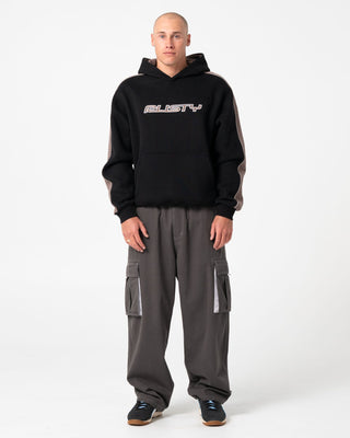 Man wearing Lay Low Hooded Fleece in Black