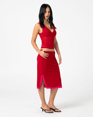 Woman wearing Camden Mesh Midi Skirt in Red / Fushia
