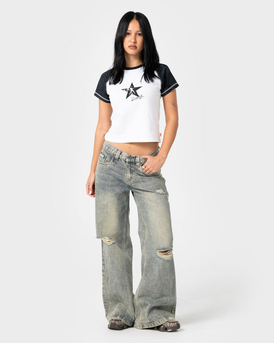 woman-wearing-starred-devil-raglan-baby-tee-in-white-washed-black