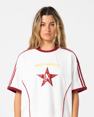 Woman wearing Starred Devil Oversized Tee in Cream / Red