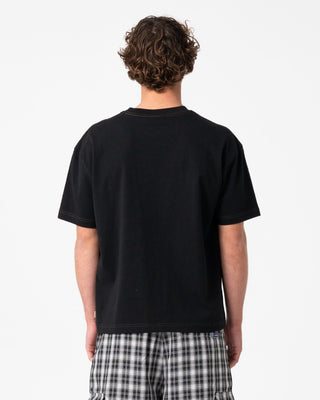 Man wearing Lay Low Short Sleeve Tee in Black