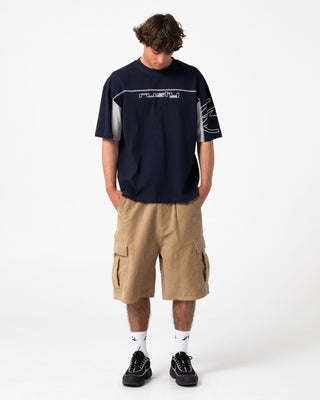 Man wearing Cyber Stripe Short Sleeve Tee in Navy Blue