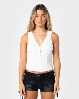 Woman wearing Peggy Sue Sleeveless Button Down Blouse in White