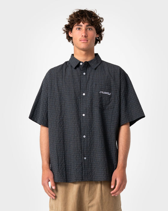 man-wearing-defender-short-sleeve-shirt-in-black