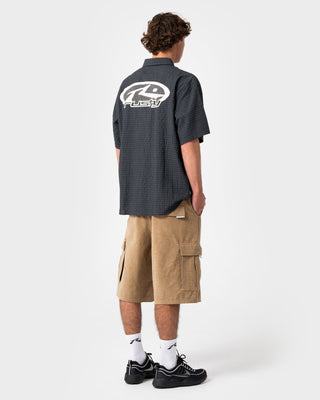 man-wearing-defender-short-sleeve-shirt-in-black