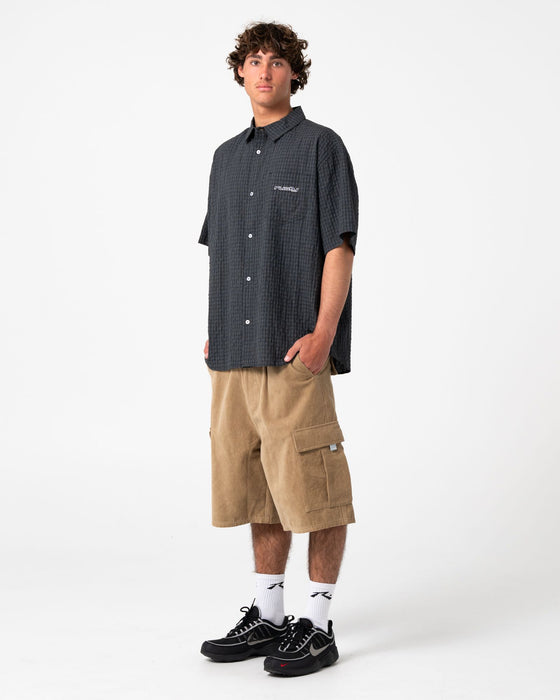 man-wearing-defender-short-sleeve-shirt-in-black