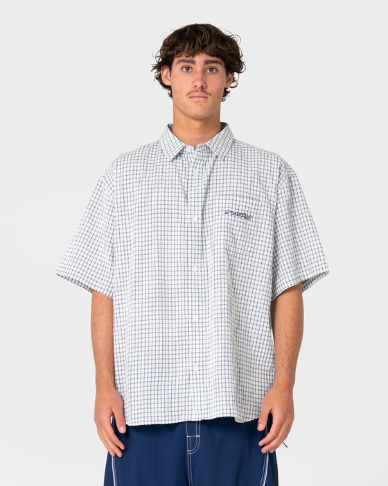 man-wearing-defender-short-sleeve-shirt-in-cream