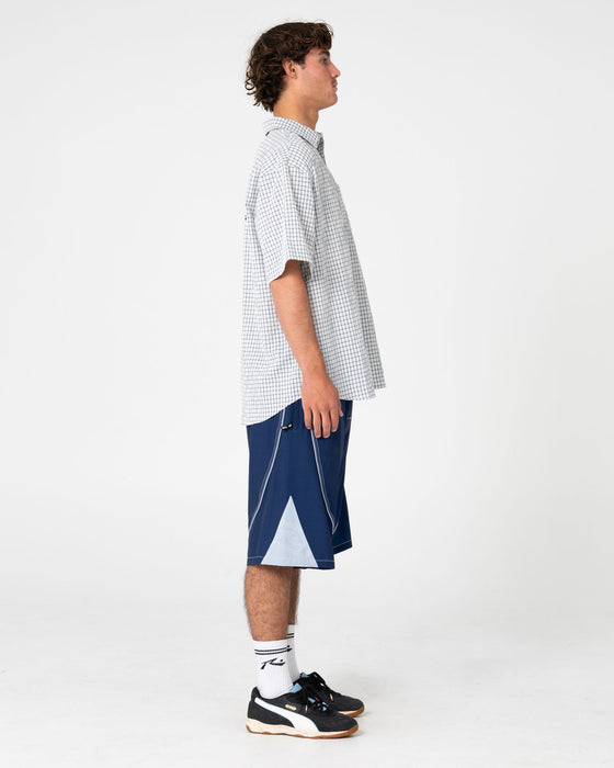 man-wearing-defender-short-sleeve-shirt-in-cream