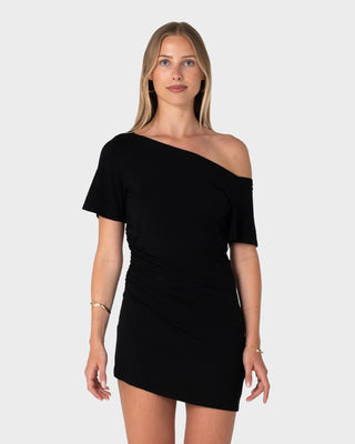 Woman wearing Sally Slouch Off Shoulder Dress in Black