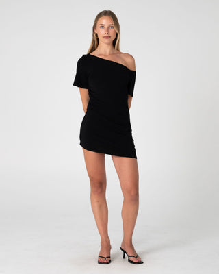 Woman wearing Sally Slouch Off Shoulder Dress in Black