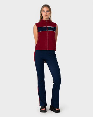 Woman wearing Bless Up Polar Fleece Vest in Cranberry / Navy Blue