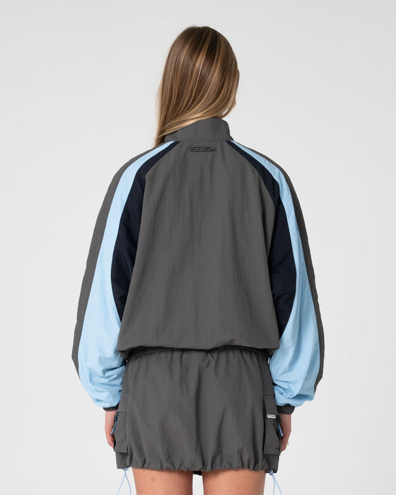 woman-wearing-breezy-wind-cheater-zip-through-jacket-in-grey-blue