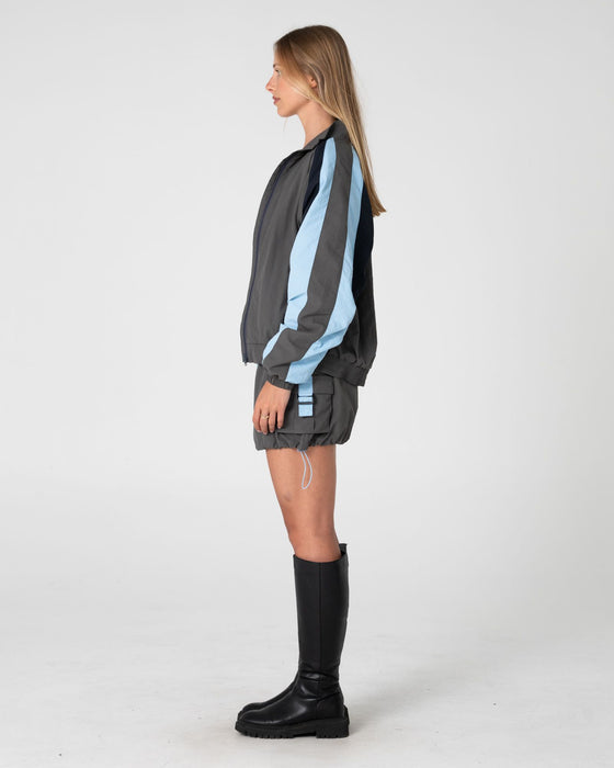 woman-wearing-breezy-wind-cheater-zip-through-jacket-in-grey-blue