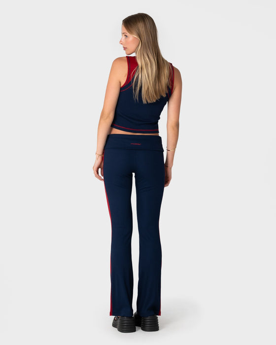 woman-wearing-hilton-low-rise-bootleg-rib-pant-in-navy-blue