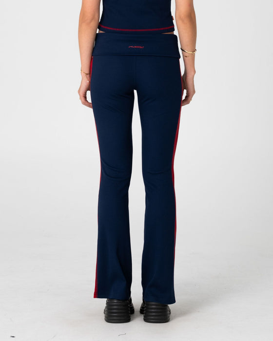 woman-wearing-hilton-low-rise-bootleg-rib-pant-in-navy-blue