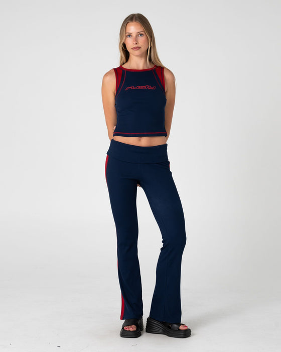 woman-wearing-hilton-low-rise-bootleg-rib-pant-in-navy-blue