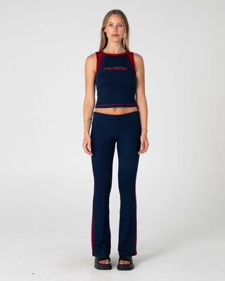 Woman wearing Hilton Low Rise Bootleg Rib Pant in Navy Blue