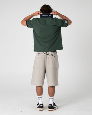 Man wearing Pop Top Short Sleeve Polo in Green Gables