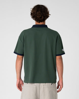 Man wearing Pop Top Short Sleeve Polo in Green Gables