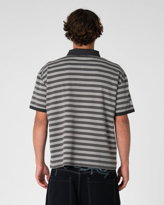 Man wearing Pop Top Short Sleeve Polo in Stone Grey