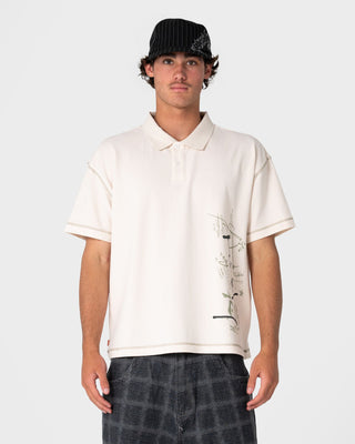 Man wearing Funkshen Short Sleeve Polo in Cream