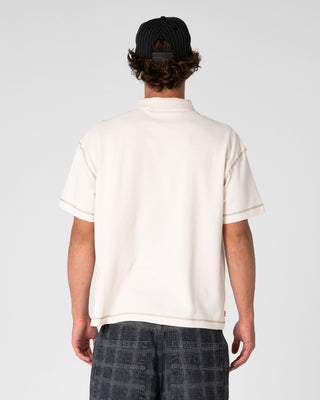 Man wearing Funkshen Short Sleeve Polo in Cream