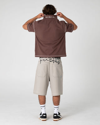 Man wearing Funkshen Short Sleeve Polo in Pinecone