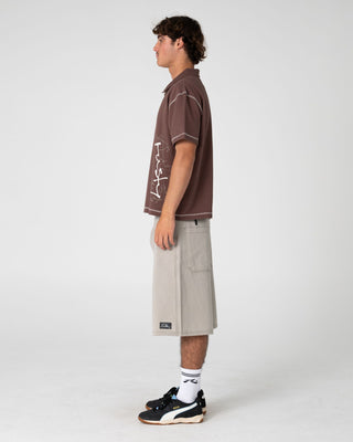 Man wearing Funkshen Short Sleeve Polo in Pinecone