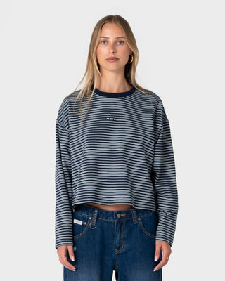 Woman wearing 17 Degrees Stripe L/S Oversize Tee in Blue Stripe