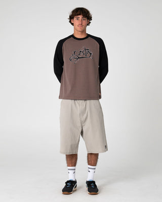 Man wearing Sip The Sizzurp Long Sleeve Tee in Pinecone